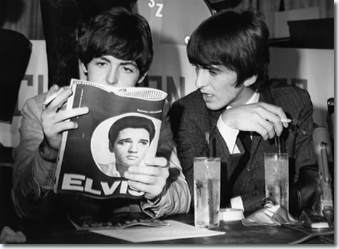 Paul McCartney and George Harrison read a magazine article about Elvis Presley.